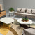 Beige zitbank, gecombineerd met unieke design salontafels van Belgische ontwerpster Christl Dekimpe.